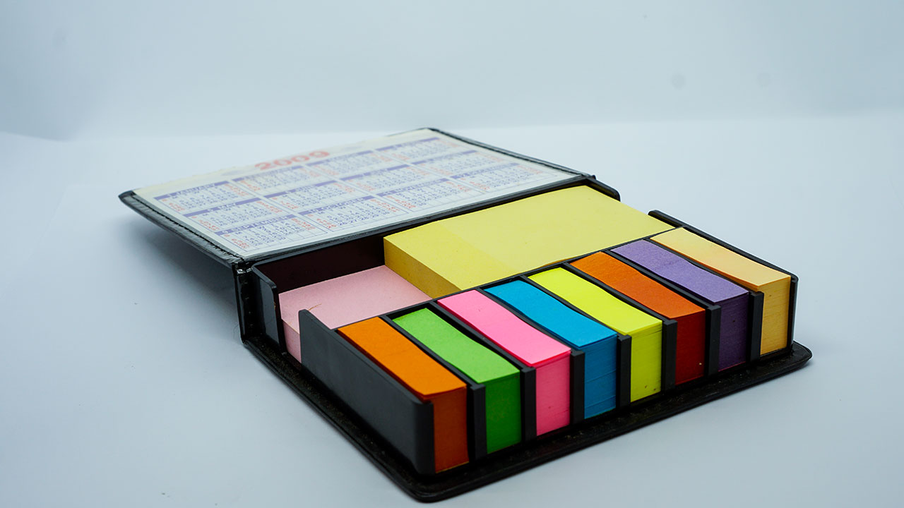 Store Sticky Notes in a Plastic Storage Box