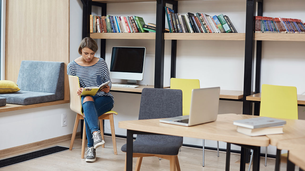 Organized study desk with dollar store items like baskets, shelves, and file organizers